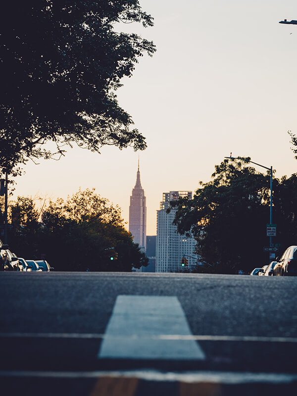 Residential street looking onto city skyline