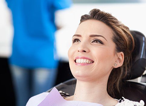 Woman at dental office smiling