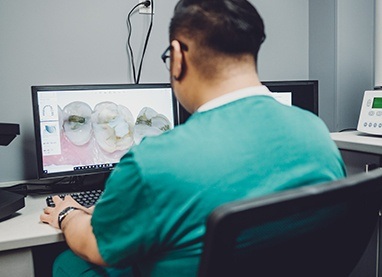 Dentist looking at 3 D smile design