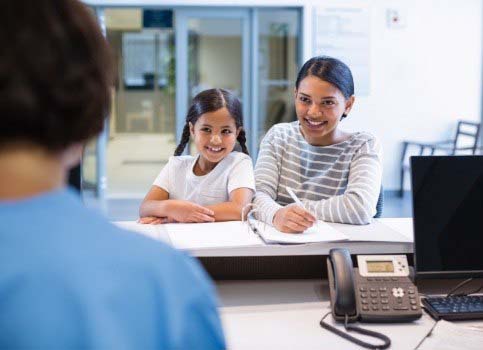 Mother and daughter learning about the cost of dental emergencies in Sunnyside