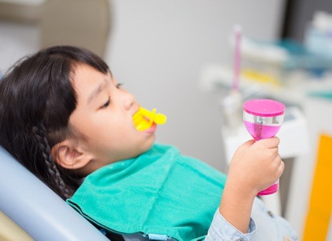 Child receiving dental sealants