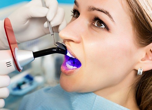 Patient receiving cosmetic dental bonding treatment