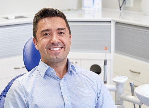 Man at dental office for dental checkup and teeth cleaning