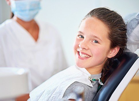 Young girl smiling after fluoride treatment