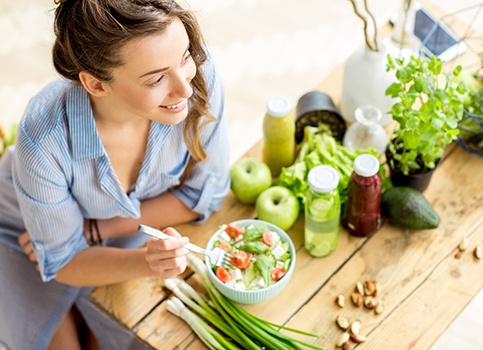 young woman eating healthy food