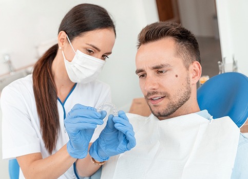 Man at dentist getting Invisalign in Sunnyside