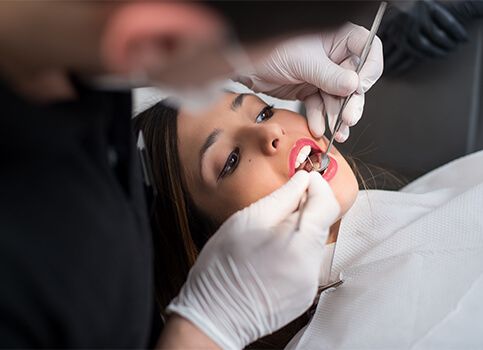 Dentist treating dental patient