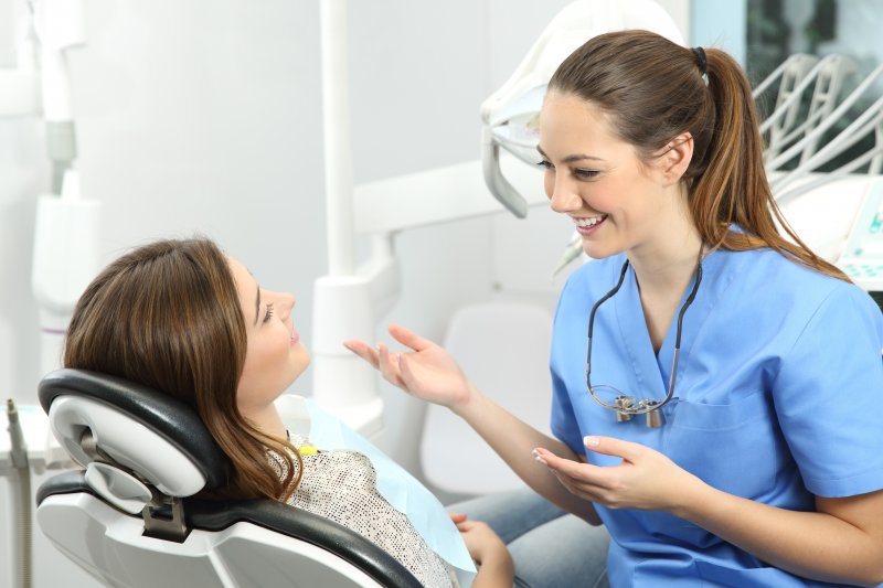 person speaking with cosmetic dentist about treatment options